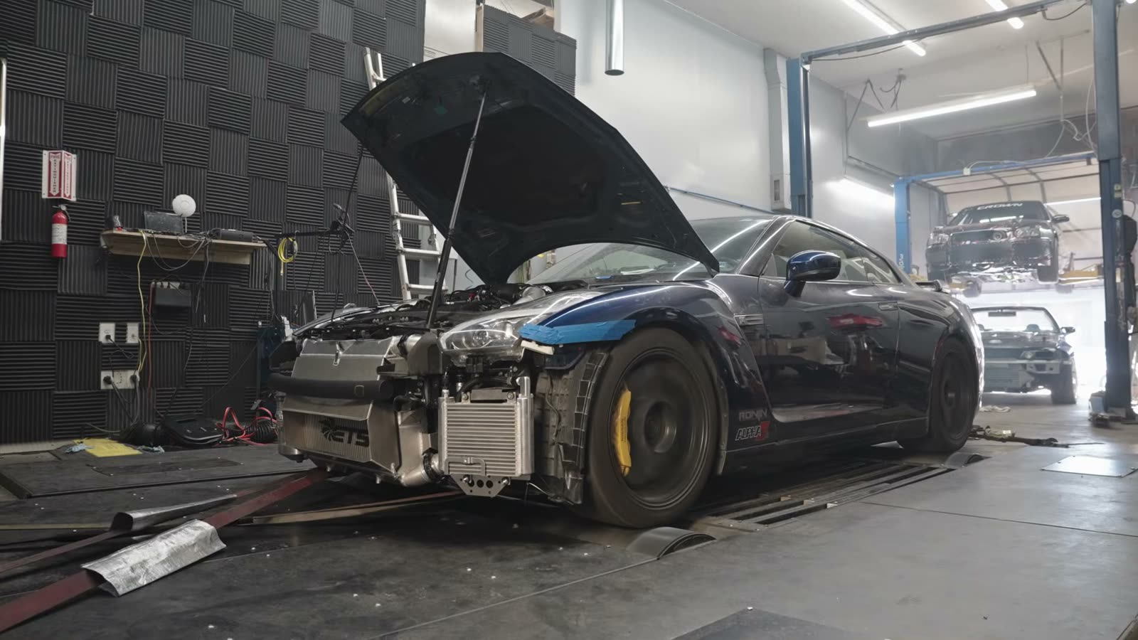 GT-R in the dyno cell with the hood up
