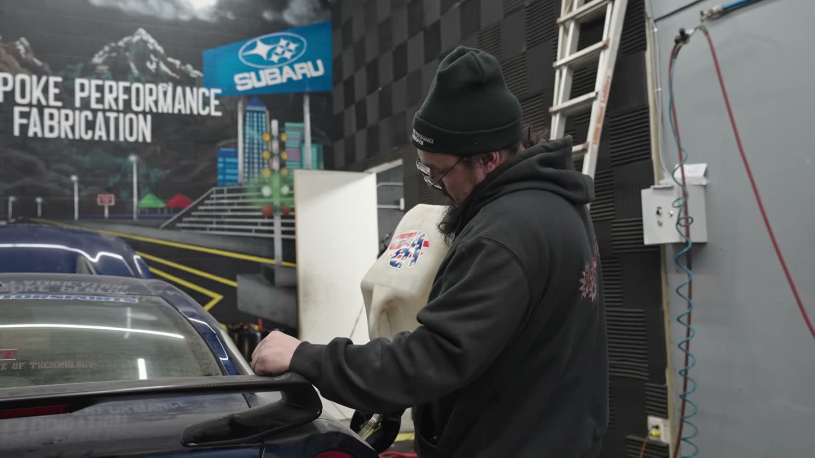 Making changes at the cowl with the GT-R still strapped