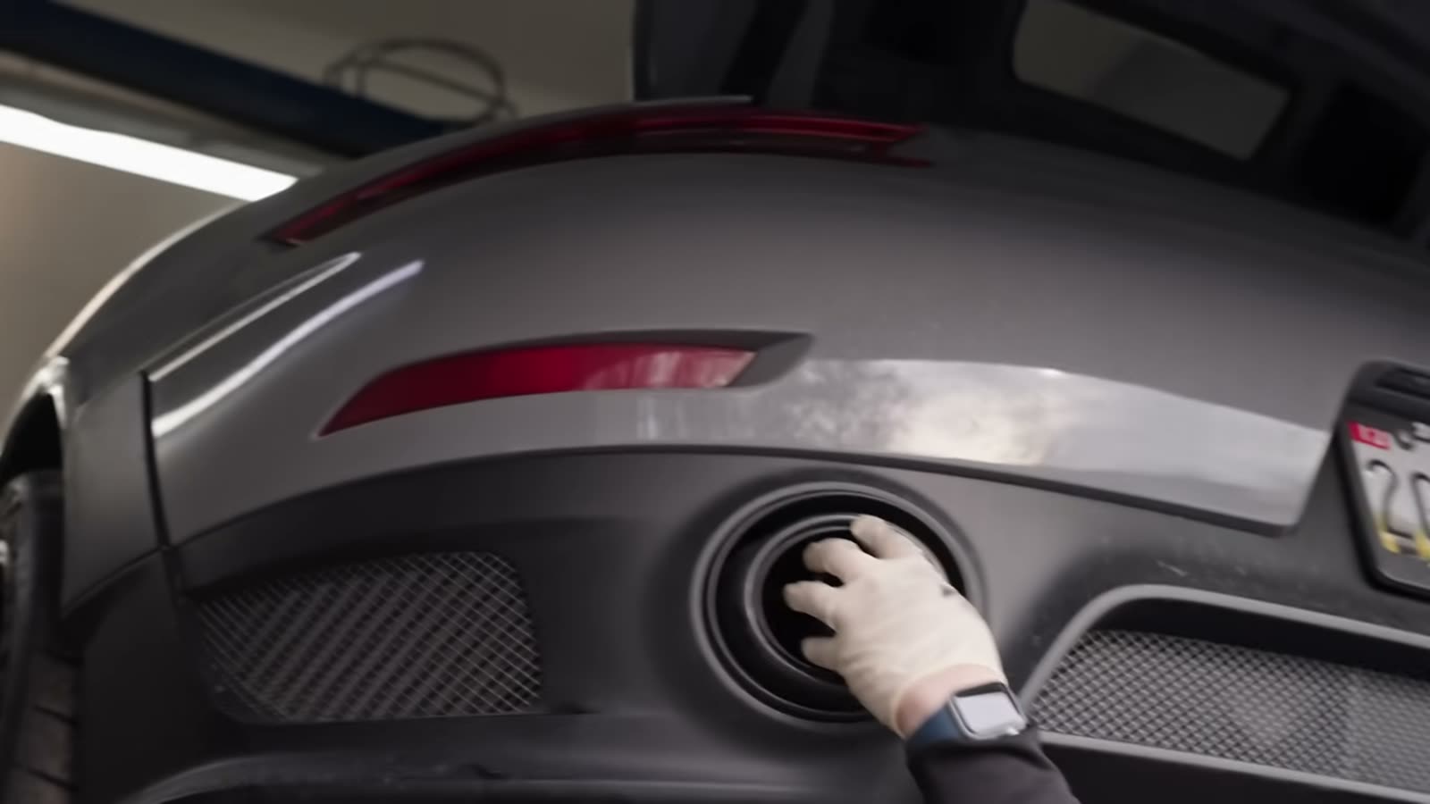 Fitting the titanium tip into the GT2 RS carbon valance