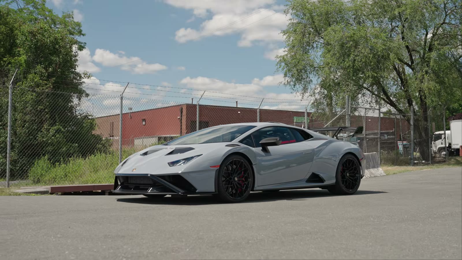 Lamborghini Huracan STO on the street outside the shop